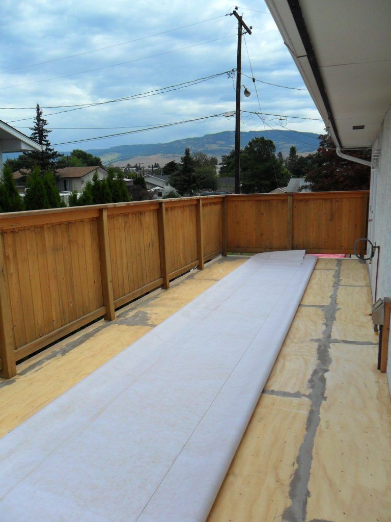 Patched deck surface prior to vinyl decking installation