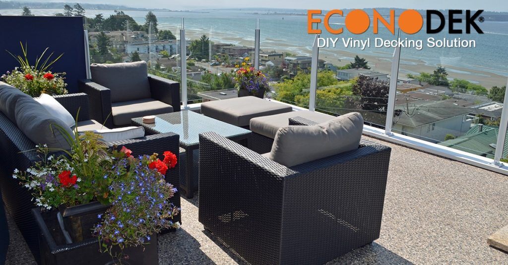 Econodek waterproof vinyl deck with outdoor furniture overlooking a lake